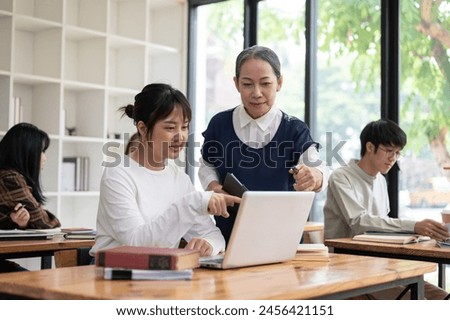 Similar – Image, Stock Photo Teacher explaining types of renewable energies in poster at ecology classroom