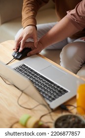 Caring Son Teaching Senior Mother How To Use Computer Mouse