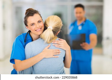 Caring Young Medical Doctor Hugging Patient