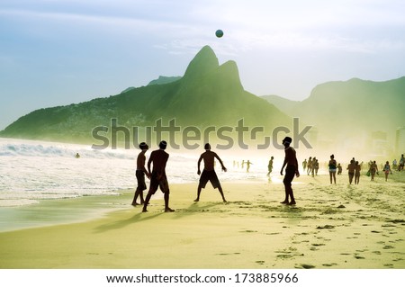Carioca Brazilians playing altinho futebol beach football kicking soccer ball Ipanema Beach Rio de Janeiro 