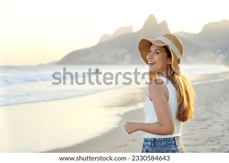 Carioca girl on Ipanema beach at sunset, Rio de Janeiro, Brazil