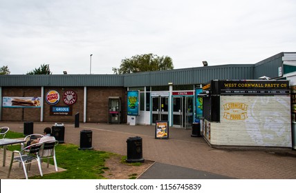 Carlisle, United Kingdom - August 11 2018:   A Grey Day At Southwaite Service Station Southbound, With Signs For Burger King, M&S Simply Food, Costa Coffee, Greggs And The West Cornwall Pasty Co