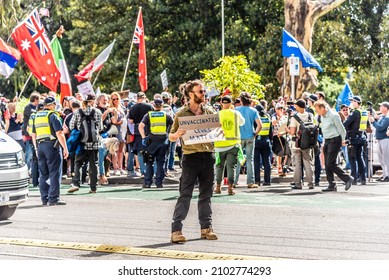 Carlton, Victoria, Australia, January 8, 2022: Victoria Police observe Novak Djokovic supporters, refugee supporters, and anti-vaccination protestors at The Park Hotel in Swanston Street, Carlton.