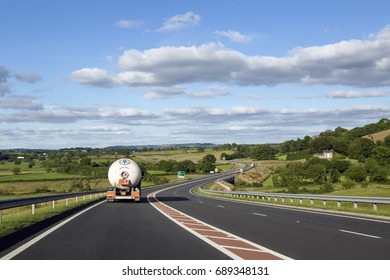 Carmarthen, UK: July 05, 2016: Following Road Haulage. Flammable Materials Being Transported Across Countryside.