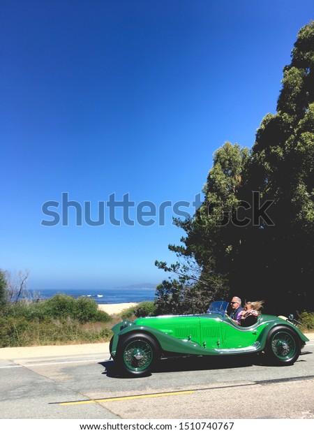 Carmel By The Sea, CA- August 15,2019: A 1932\
Maserati V4 Zagato Spider cruising southbound on Highway 1 during\
the Tour d’Elegance.