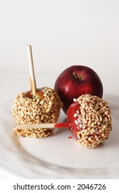 Carmel, Candy And Regular Apple With Nuts On A White Plate And White Background.