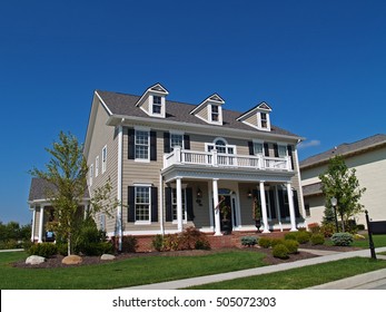 CARMEL, INDIANA - MAY 9, 2014:  New Construction Large Two-story Tan Home Styled To Look Like An Historic House.