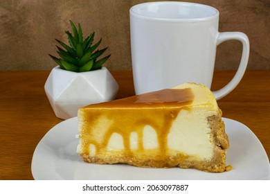 Carmel Top Cheese Cake Served With A Cup Of Coffee