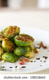 Carmelized Brussel Sprouts With Bacon, Blue Cheese, Thyme, And Balsamic Reduction.