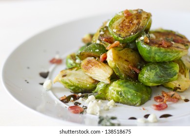 Carmelized brussel sprouts with bacon, blue cheese, thyme, and balsamic reduction.