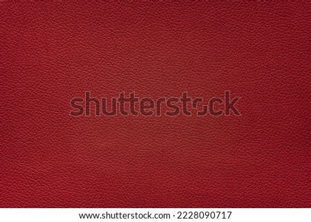 Carmine red color leather texture.