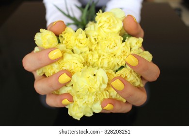 Carnations In Hands With Yellow Nails