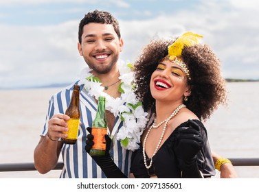 Carnaval in Brasil, happy couple enjoying brazilian party in costume