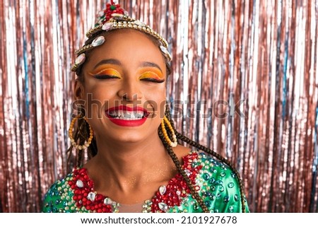 Carnaval in Brazil, cheerful black woman in carnaval costume at brazilian party with fashion makeup