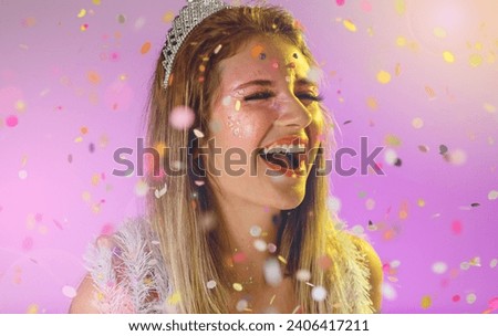 Carnaval Brazil. Excited and Cheerful. Throwing confetti. Face of young woman with colorful makeup, dressed up for fun. Bright background. Party concept, celebration and festival.