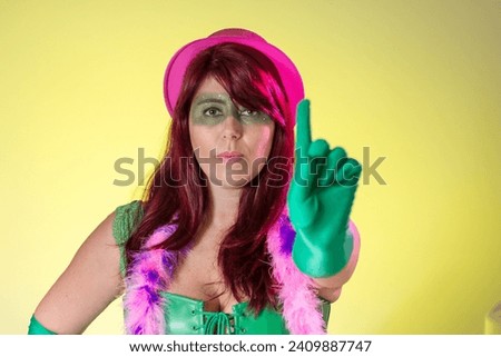 Carnaval Brazil. Hands and gesture: no harassment. Portrait of brazilian red hair woman with green make up mask. Bright and Colorful. Holiday concept, tradition and costume.