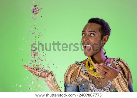 Carnaval Brazil. Happiness and Joy. Throwing confetti. Bright background. Party concept, celebration and festival. Face of brazilian man wearing costume.