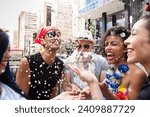 Carnaval party. Crowd of Brazil people in costume celebrating in parade festival. Happy brazilian partygoers in costume having fun in parade festival.