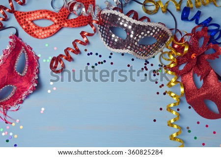 Carnival  background with mask, serpentine and confetti. View from above