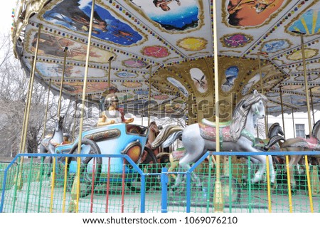 Carnival carousel in empty early spring park