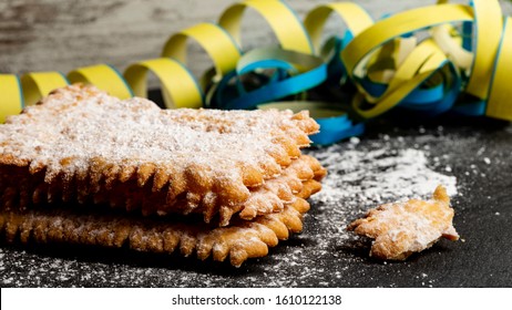 Carnival fritters topped with icing sugar, a typical Italian sweet of Carnival celebrations. - Shutterstock ID 1610122138