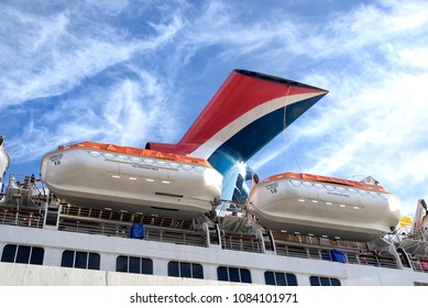 Carnival Liberty With Rescue Boats On It's Side. Carnival Cruise Lines Funnel. March 18,  2018 Nassau, Bahamas