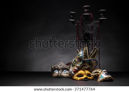 Carnival mask with candlestick and necklace