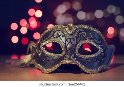 Carnival mask on a background of holiday lights. - Shutterstock ID 166264481