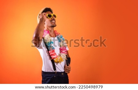 Carnival Outfit Party. Portrait of Black Man With Carnival Props Isolated on Orange Background, space for text. 