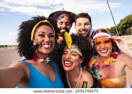 Carnival Party in Brazil, portrait of young people having fun at fest event dressed