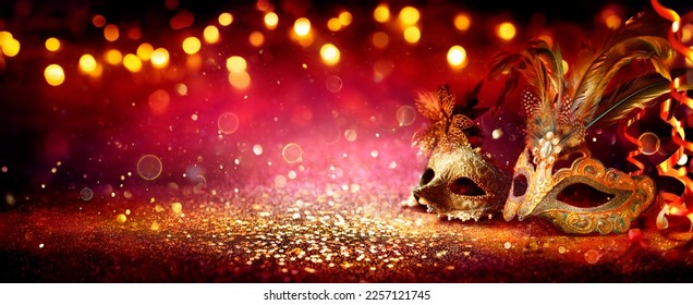 Carnival Party - Venetian Masks On Red Glitter With Shiny Streamers On Abstract Defocused Bokeh Lights - Shutterstock ID 2257121745