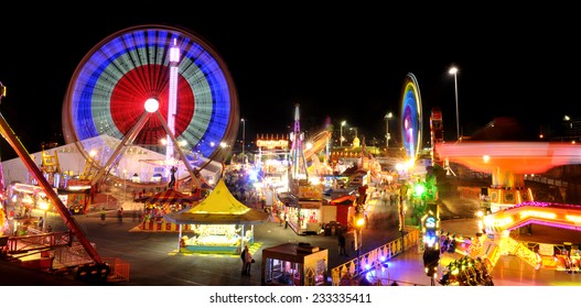 Carnival Rides In Action At Night.