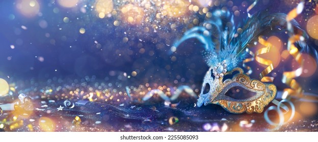 Carnival - Venetian Mask Party - Masquerade Disguise With Shiny Streamers On Abstract Defocused Bokeh Lights - Shutterstock ID 2255085093