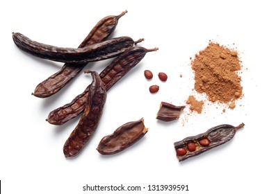 Carob Bean Pods, Seeds And Powder On White Background