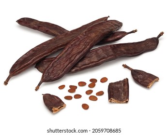 Carob, ceratonia fruits with seeds isolated on white background - Shutterstock ID 2059708685