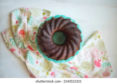 Carob Handmade Cake On A Green Cake Stand.