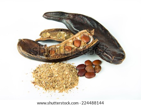 Carob pods and grains isolated on white background