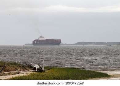 Carolina Beach, NC - April 14 2018: A Cargo Ship Nears The Wilmington Port.