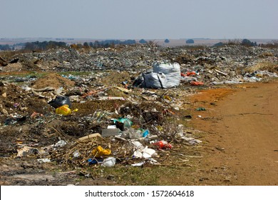 Carolina, South Africa, May 2019,  Garbage Collection Bags And Other Plastic Objects And Trash Waste Disposal Site Ready To Be Collected By Waste Disposal Company For Recycling Into Useful Items