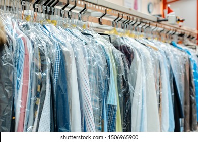 Carousel Of Clothing Waiting For Pick-up By Their Owners In Dry Cleaning Shop