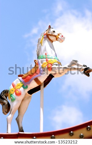 Carousel horse with blue sky background