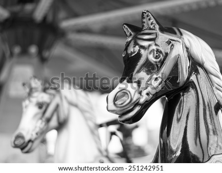 Carousel or merry-go-round horses at a fairground.