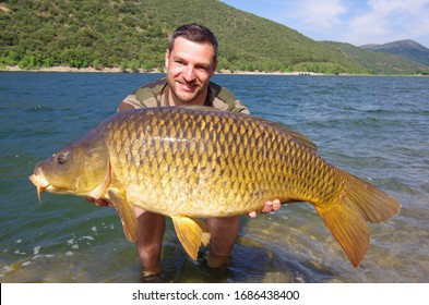 Carp Fishing, Catch Of Fish, Man Holding A Big Common Carp