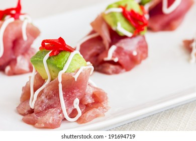 Carpaccio Of Ahi Tuna Topped With Avocado And Pickled Ginger, Drizzled With Aioli