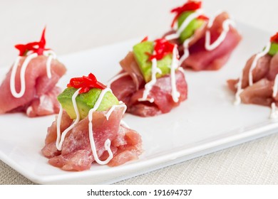 Carpaccio Of Ahi Tuna Topped With Avocado And Pickled Ginger, Drizzled With Aioli