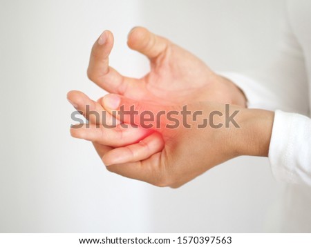 carpal tunnel syndrome and gout,including lupus and lyme disease in woman and she touching on her finger with red spot and symptoms of pain use for health care and medicine product concept