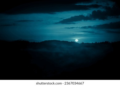 Carpathian mountains under the moon. Haloween background.