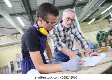 Carpenter With Apprentice In Training Period