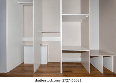 A carpenter assembling a wardrobe in a vestibule, a precise handiwork.