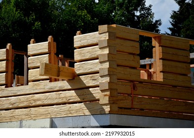 A Carpenter Built A Log Cabin With Rough Hewn Beams. Wood Planing Was Not Done Before. Authentic Craftsmanship Wooden Log Cabin. Mortises For Placing Roof Beams. Gouging Wood, Ax, Cut, Pull Strap